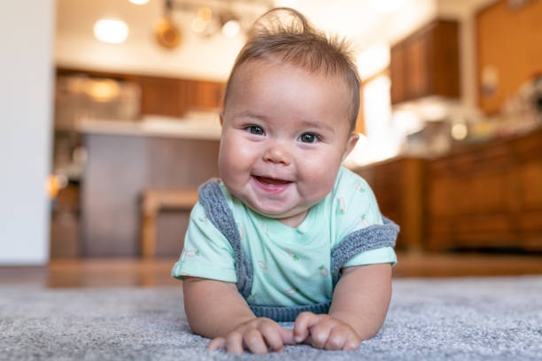 Baby lying on carpet flooring | Chesapeake Family Flooring